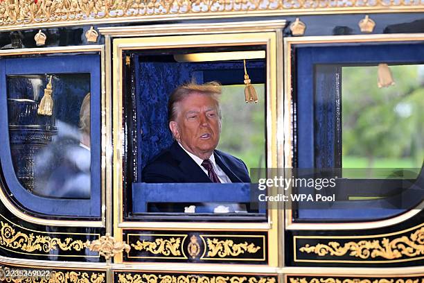 King Charles III and U.S President Donald Trump during the carriage procession through the Windsor Estate at Windsor Castle during the State visit by...
