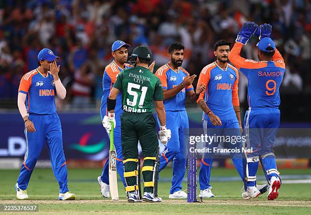Jasprit Bumrah of India celebrates with team mates after dismissing Mohammad Hari of Pakistan during the Asia Cup match between India and Pakistan at...