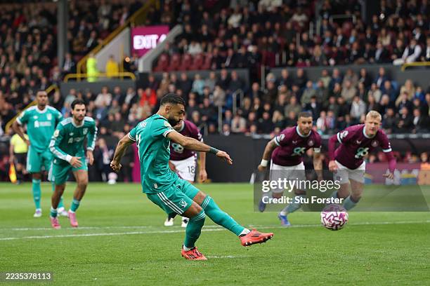 Mohamed Salah of Liverpool scores his team's first goal from the penalty spot during the Premier League match between Burnley and Liverpool at Turf...