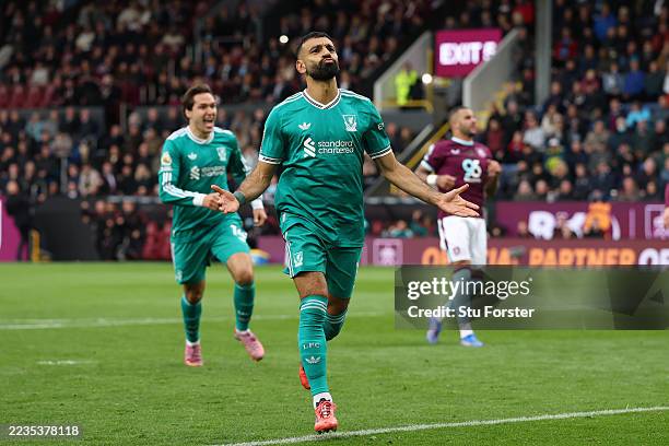 Mohamed Salah of Liverpool celebrates scoring his team's first goal from the penalty spot during the Premier League match between Burnley and...