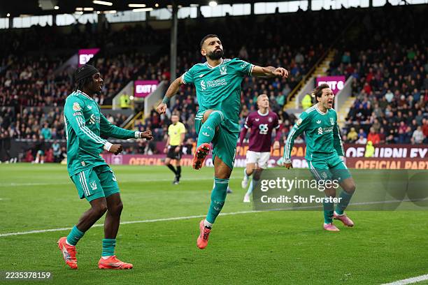 Mohamed Salah of Liverpool celebrates scoring his team's first goal from the penalty spot during the Premier League match between Burnley and...