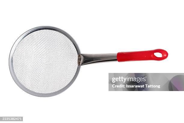 a red and silver spatula with a mesh handle - vergiet stockfoto's en -beelden