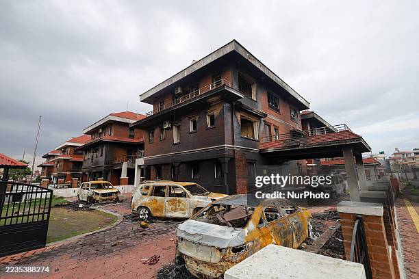 Torched vehicles are seen inside the vandalized ministerial quarter of Nepal in Lalitpur, Nepal, on September 17, 2025. The government residence of...
