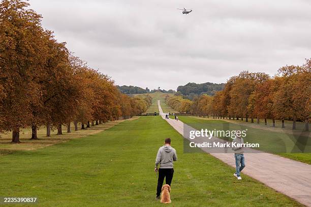 Marine Corps' VH-3D Sea King helicopter known as Marine One when carrying the US President flies over the Long Walk in Windsor Great Park as...