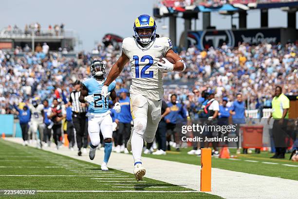 Puka Nacua of the Los Angeles Rams scores a touchdown against the Tennessee Titans during the first quarter in the game at Nissan Stadium on...