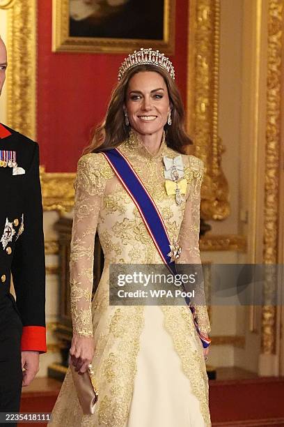 Catherine, Princess of Wales arrives for the State Banquet hosted by King Charles III and members of the Royal Family at Windsor Castle during the...