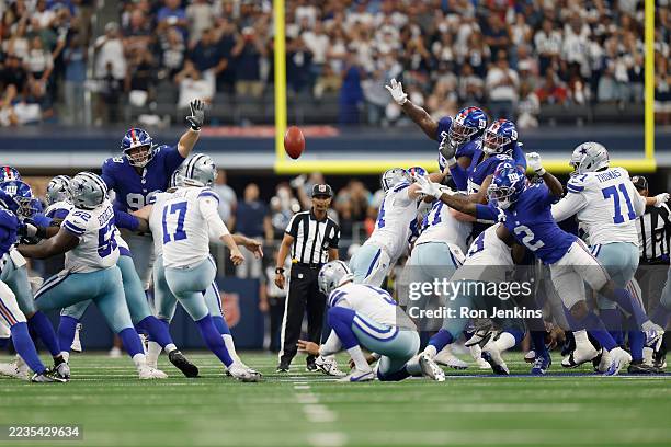 Brandon Aubrey of the Dallas Cowboys kicks a field goal to force overtime in the fourth quarter of the game against the New York Giants at AT&T...