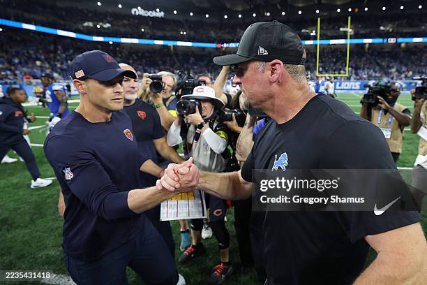 Head coach Ben Johnson of the Chicago Bears and Head coach Dan Campbell of the Detroit Lions shake hands following the game at Ford Field on...