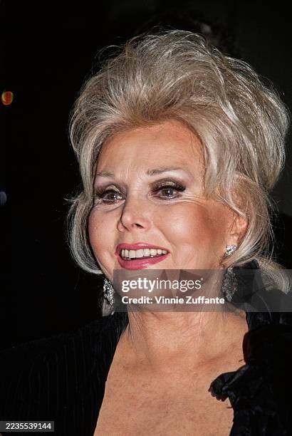 Hungarian-American socialite and actress Zsa Zsa Gabor wearing diamond earrings, circa 1990.