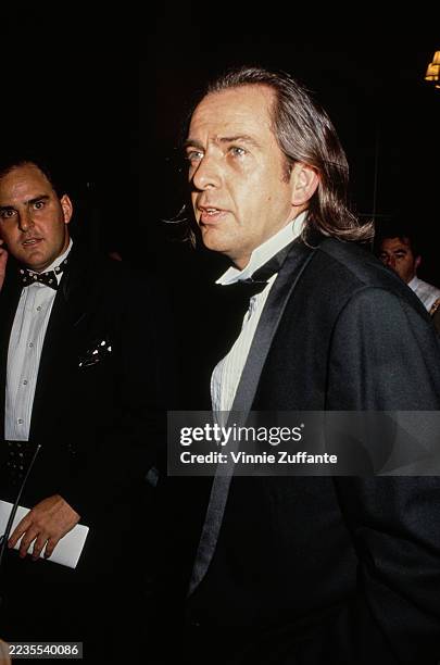 British singer-songwriter Peter Gabriel, wearing a black tuxedo and bow tie, attends the 6th Annual American Cinematheque Awards, held at the Century...