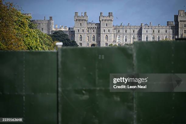 Windsor Castle is seen in the distance, beyond a large "ring of steel" security fence surrounding sections of the Long Walk, ahead of the State Visit...