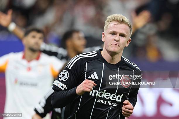 Frankfurt's German forward Jonathan Burkardt celebrates scoring the 3-1 goal during the UEFA Champions League league phase day 1 football match...