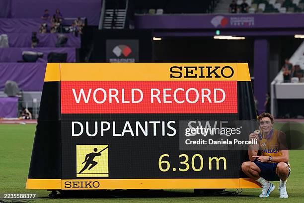 Armand Duplantis of Sweden poses for a photo next to the World Record screen celebrating his victory of the Gold medal during the Pole Vault Men...