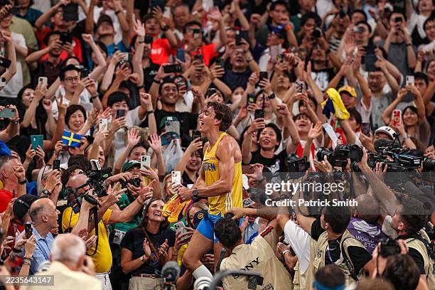 Armand Duplantis of Team Sweden celebrates with fans after he set a new world record by clearing an attempt of 6.30 Metres during the Men's Pole...