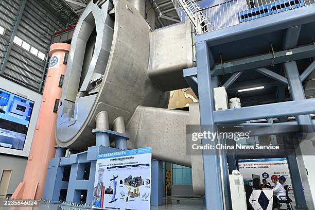 Researchers operate the research platform for remote operation of cladding system for a fusion reactor on September 15, 2025 in Hefei, Anhui Province...