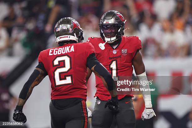 Rachaad White of the Tampa Bay Buccaneers celebrates with Emeka Egbuka after scoring a 2 yard touchdown against the Houston Texans during the fourth...
