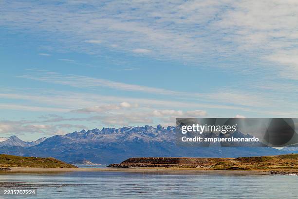 ushuaia bay reflecting the martial mounts in tierra del fuego, argentina - tierra del fuego province chile stock pictures, royalty-free photos & images