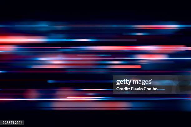 luminous streaks of light flow in the night - light trail imagens e fotografias de stock