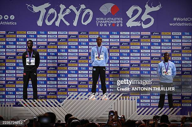 Silver medallist Trinidad and Tobago's Jereem Richards, Gold medallist Botswana's Busang Collen Kebinatshipi and Bronze medallist Botswana's Bayapo...