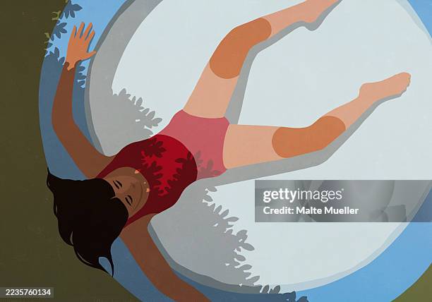 view from above young woman relaxing in partial shade in kiddie pool - pool above stock illustrations