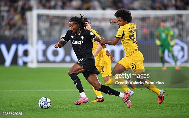 Khephren Thuram of Juventus runs with the ball whilst under pressure from Karim Adeyemi of Borussia Dortmund during the UEFA Champions League 2025/26...