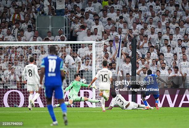 Timothy Weah of Olympique de Marseille scores his team's first goal past Thibaut Courtois of Real Madrid during the UEFA Champions League 2025/26...