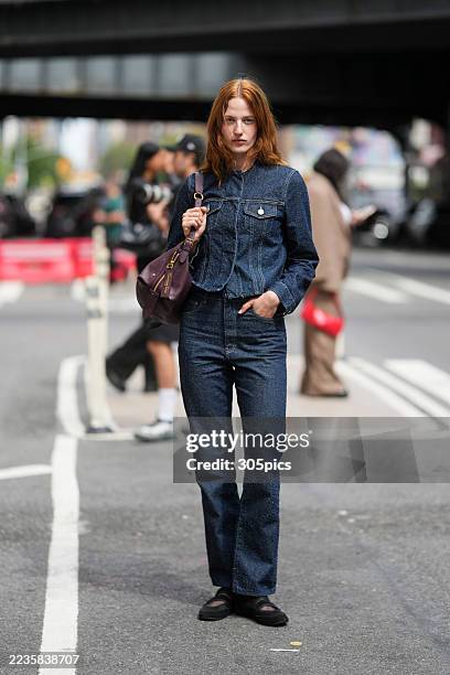 Julia Banas is seen wearing a Bimba y Lola denim jacket, denim jeans, black shoes and carrying a Christian Dior burgundy shoulder bag outside of the...
