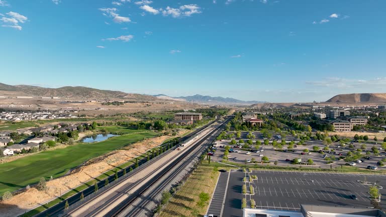 https://media.gettyimages.com/id/2235850120/video/solar-panels-on-an-office-building-rooftop-and-lehi-frontrunner-station-in-utah-usa-aerial.jpg?b=1&s=640x640&k=20&c=gejyoCsCcN-NRaEWG7DNPsKg9q_RT3iqUWyGMrDGQCo=