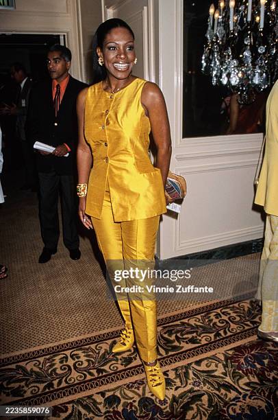 American actress and singer Sheryl Lee Ralph, wearing a sleeveless yellow tunic with yellow trousers, attends the 5th Annual Women in Film 'Lucy'...