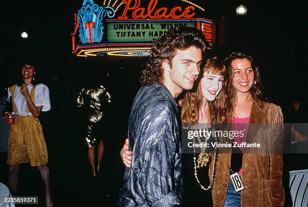 American guitarist Dweezil Zappa, American singer Tiffany Darwish, and American actress Moon Unit Zappa attend Tiffany's 18th birthday celebrations...