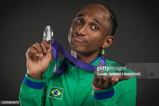 Silver medallist Brazil's Alison dos Santos poses for portraits during a studio photo session for the men's 400m hurdles final on the sidelines of...