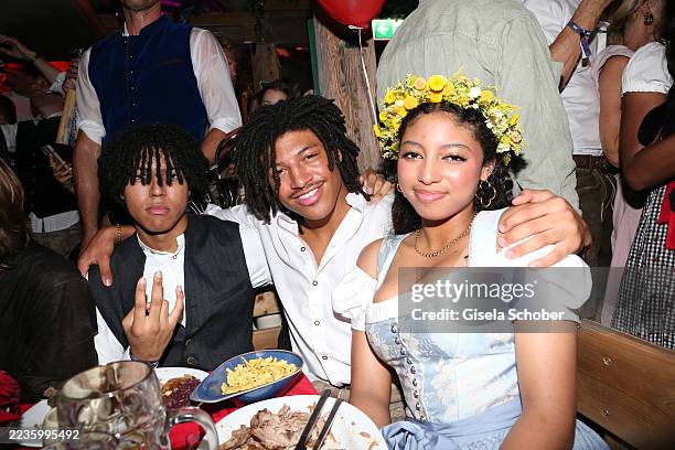 Johan Samuel, Henry Samuel, Lou Klum during the 2025 Oktoberfest opening at Käfer Wiesn-Schänke Theresienwiese on September 20, 2025 in Munich,...