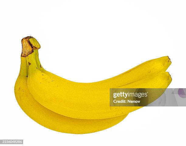 three ripe bananas on a white background - banaan stockfoto's en -beelden