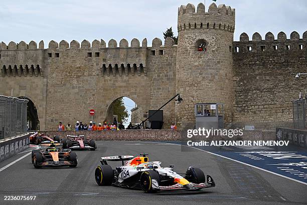 Drivers compete during the Formula One Azerbaijan Grand Prix at the Baku City Circuit in Baku on September 21, 2025.