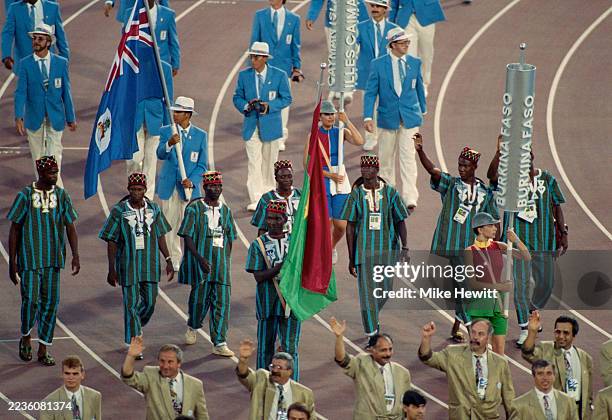 Long Jumper Franck Zio leading the Olympic team from Burkina Faso enters the stadium bearing the national flag of Burkina Faso during the Olympic...