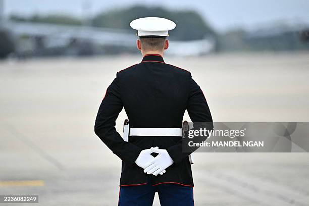 Marine stands by at Joint Base Andrews in Maryland on September 21, 2025. Trump is heading to Glendale, Arizona to attend the public memorial service...