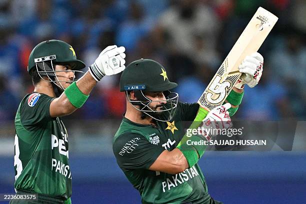 Pakistan's Sahibzada Farhan celebrates after scoring a half-century as his teammate Saim Ayub gestures during the Asia Cup 2025 Super Four Twenty20...