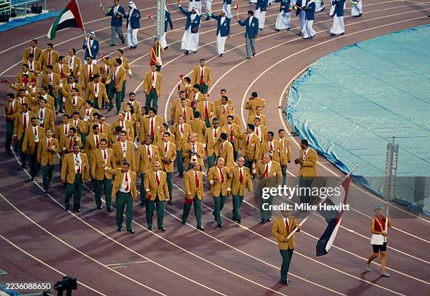 Skeet shooter Mohamed Khorshed leading the Olympic team from Egypt enters the stadium bearing the national flag of Egypt during the Olympic Parade Of...