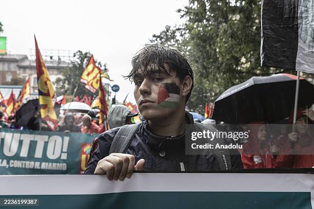People gather at the train station to participate in the general strike against the ongoing Israeli attacks in Gaza called by the USB union in Milan,...
