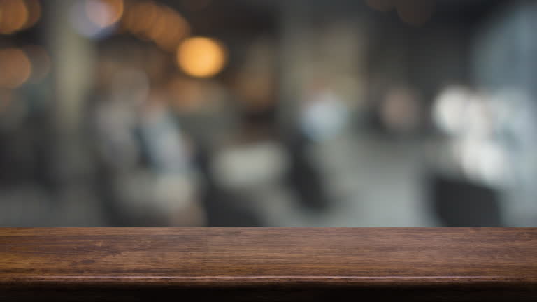 https://media.gettyimages.com/id/2236207719/video/empty-wood-table-with-people-meeting-in-cafe-working-space-restaurant-with-bokeh-light.jpg?b=1&s=640x640&k=20&c=6k0MGTpwTsQj-Bn9I11PSlEFRrzwRWrZC5cBkclMU1I=