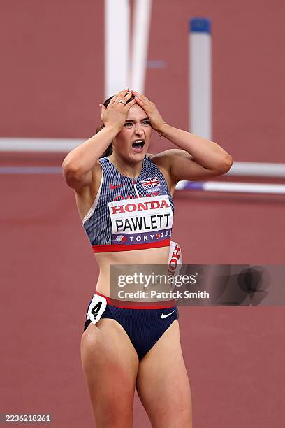 Abigail Pawlett of Team Great Britain reacts after falling over the final hurdle during the 100 Metres Hurdles leg of the Heptathlon on day seven of...