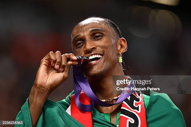 Silver medalist, Alison Dos Santos of Team Brazil, bites the medal after competing in the Men's 400 Metres Hurdles Final on day seven of the World...
