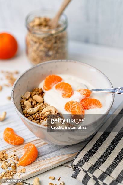 granola with tangerines - cashew stock pictures, royalty-free photos & images