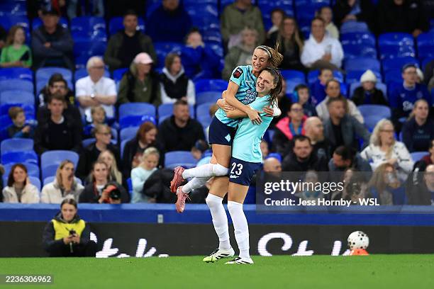 Isobel Goodwin of London City Lionesses celebrates scoring her team's first goal with Kosovare Asllani during the Barclays Women's Super League match...