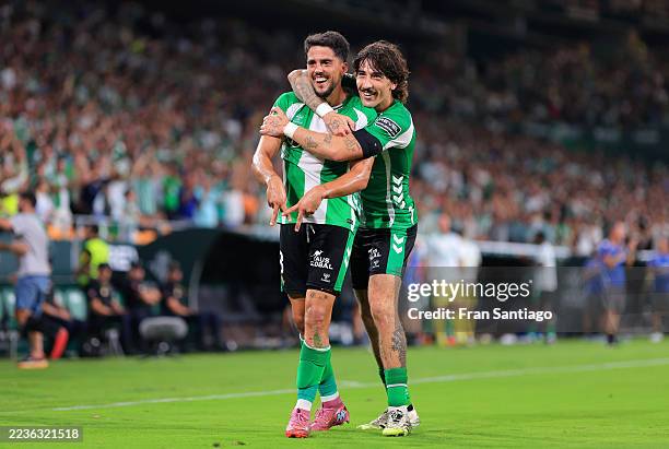 Pablo Fornals of Real Betis celebrates scoring his team's third goal with teammate Hector Bellerin during the LaLiga EA Sports match between Real...