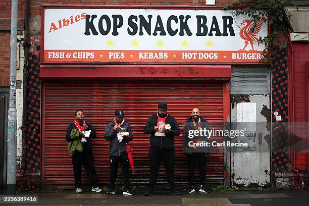 Liverpool fans eat food outside Albies Kop Snack Bar prior to the Premier League match between Liverpool and Everton at Anfield on September 20, 2025...