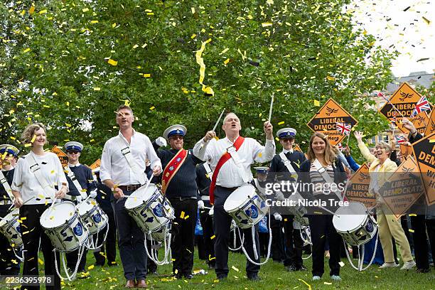 Sir Ed Davey leader of the Liberal Democrats arrives the Cenotaph in Bournemouth central gardens with a marching band to open the Liberal Democrat...