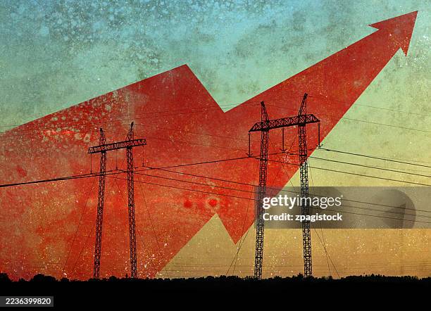 rising energy prices and demand illustrated by red arrow graph with electrical transmission towers silhouetted against grunge sky - konsum stock-fotos und bilder