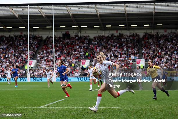 Ellie Kildunne of England races clear to score her team's first try during the Women's Rugby World Cup 2025 Semi Final match between France and...