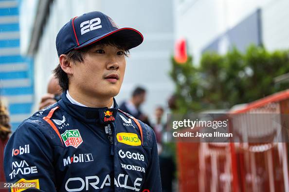 Oracle Red Bull Racing Japan Yuki Tsunoda of Japan and Oracle Red Bull Racing walks in the paddock ...